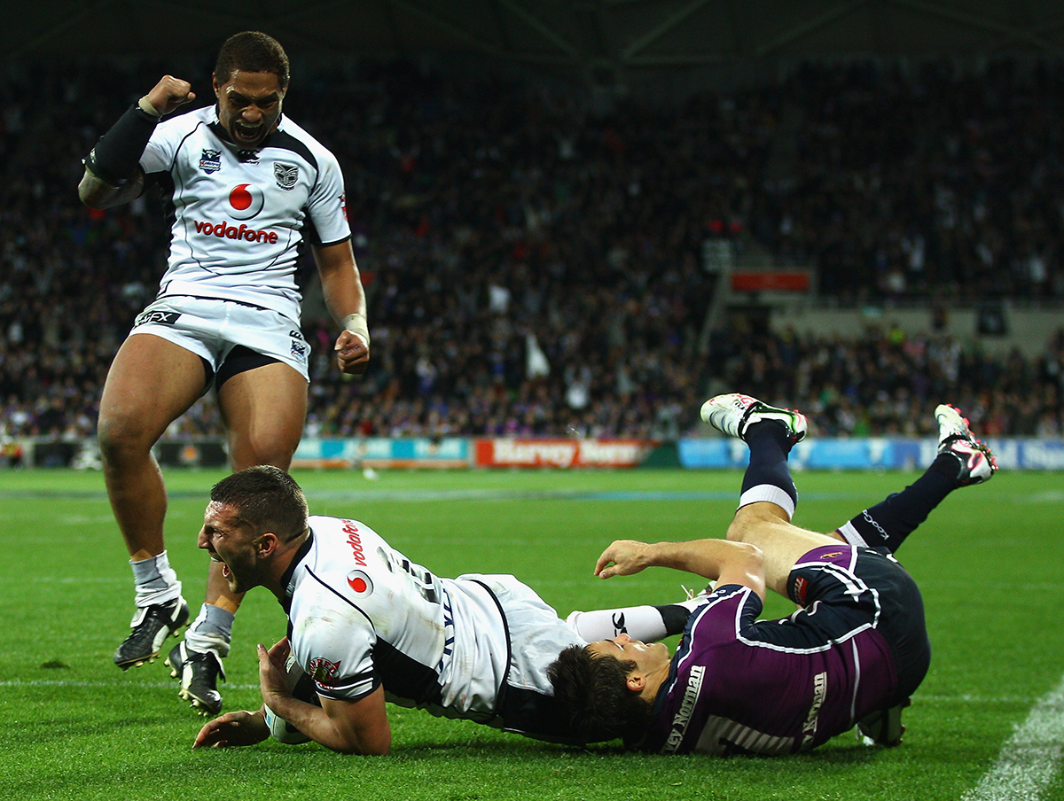 Lewis Brown of the Warriors celebrates a try with Manu Vatuvei during the NRL second preliminary final match between the Melbourne Storm and the New Zealand Warriors at AAMI Park in Melbourne