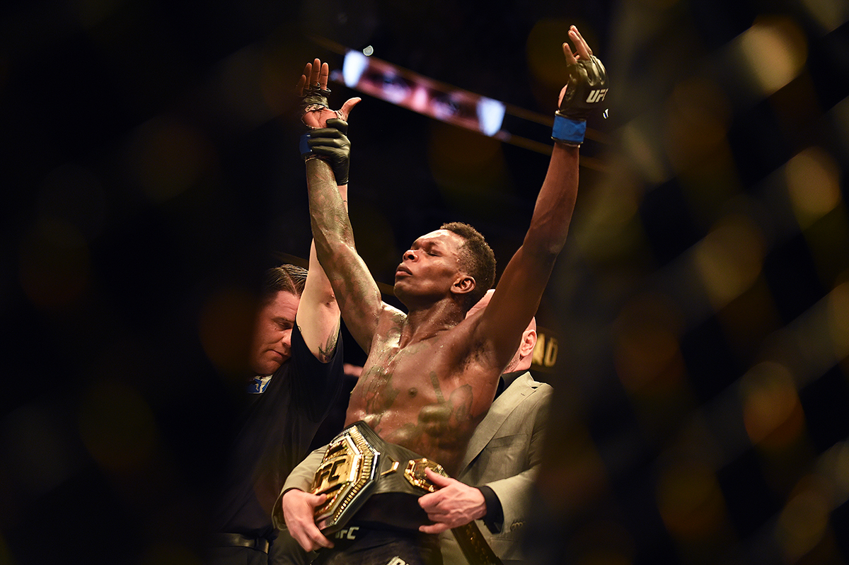 Israel Adesanya celebrates after winning the title by defeating Kelvin Gastelum during the UFC 236 event at State Farm Arena on April 13 2019 in Atlanta Georgia