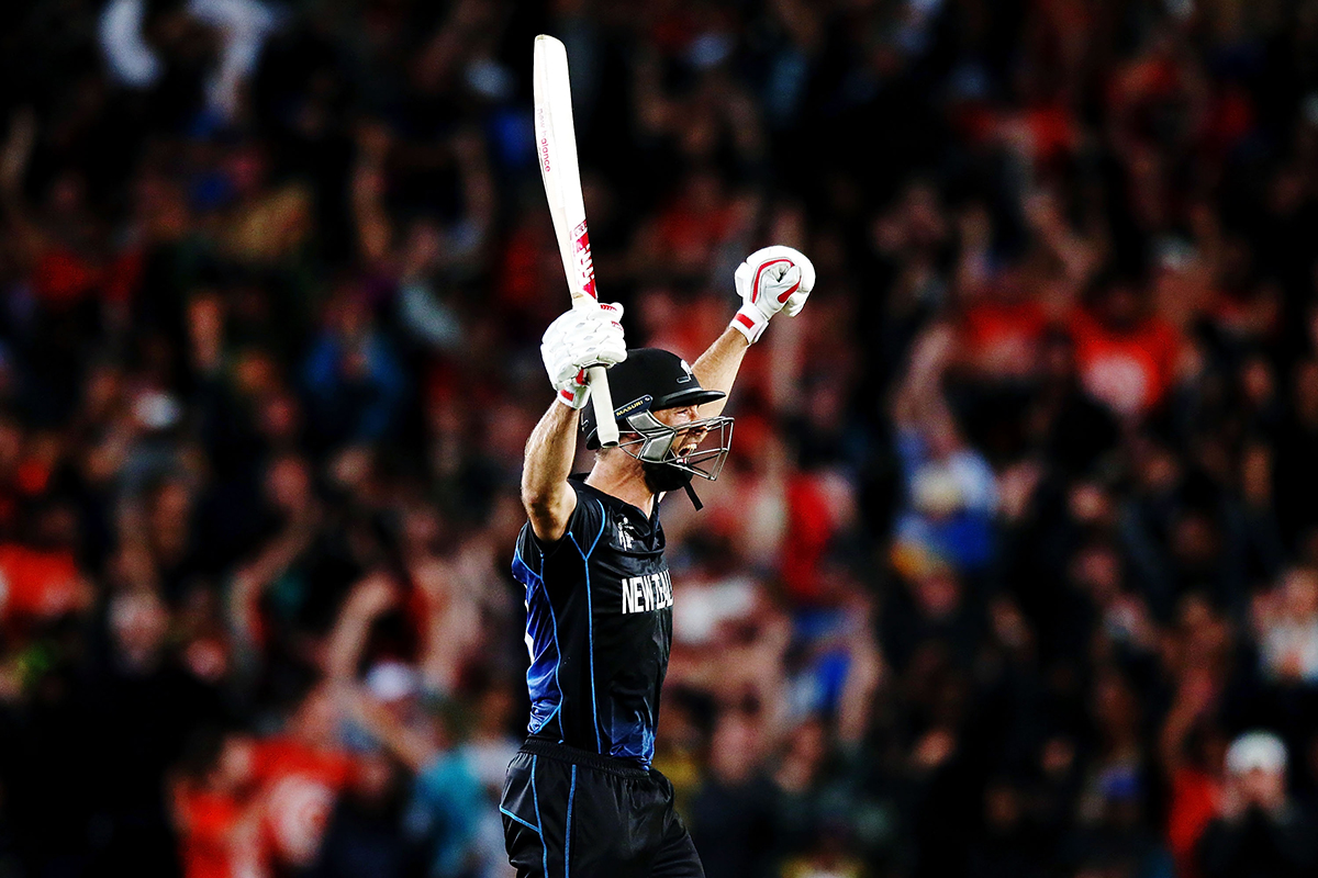 Grant Elliott celebrates after hitting a six to win the 2015 Cricket World Cup Semi Final match between New Zealand and South Africa at Eden Park on March 24 2015