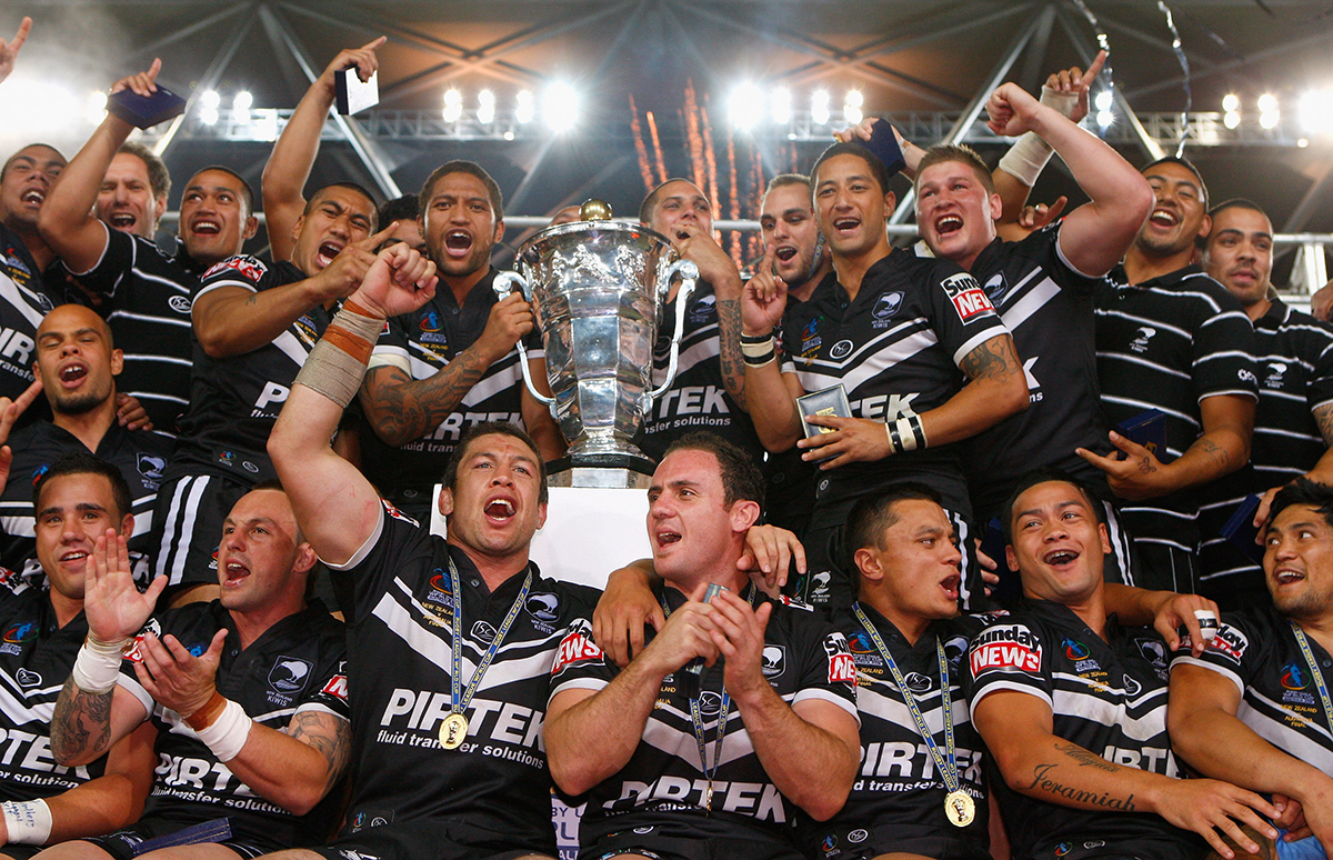 The Kiwis celebrate with the world cup trophy after winning the 2008 Rugby League World Cup Final match between the Australian Kangaroos and the New Zealand Kiwis at Suncorp Stadium in Brisbane
