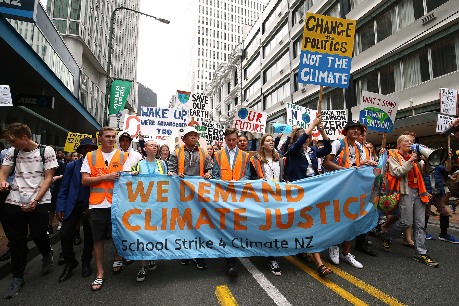 GettyImages 1135841616 Students demonstrating with banners and signs for climate justice
