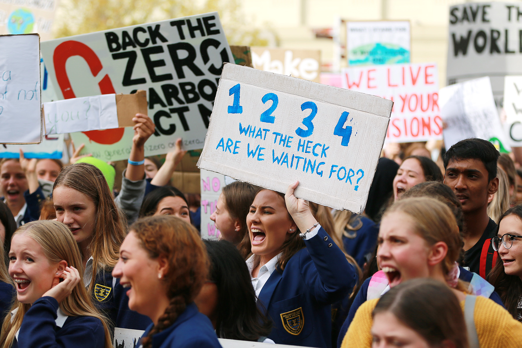 Student protesters with signs yelling